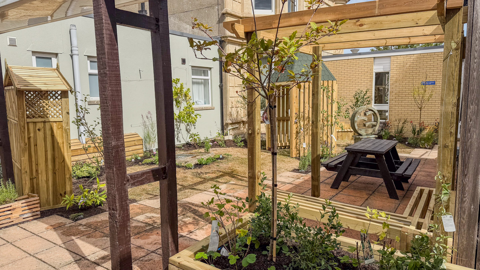 KAP Woodwork & Building Services | What Does Garden Landscaping in Dorset Include? Natural stone patio installation in Dorset garden with clean paving and drainage work