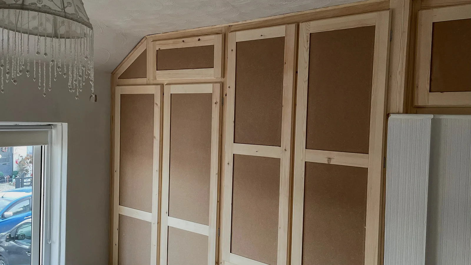 Skilled carpenter working on bespoke woodwork project in Dorset home interior